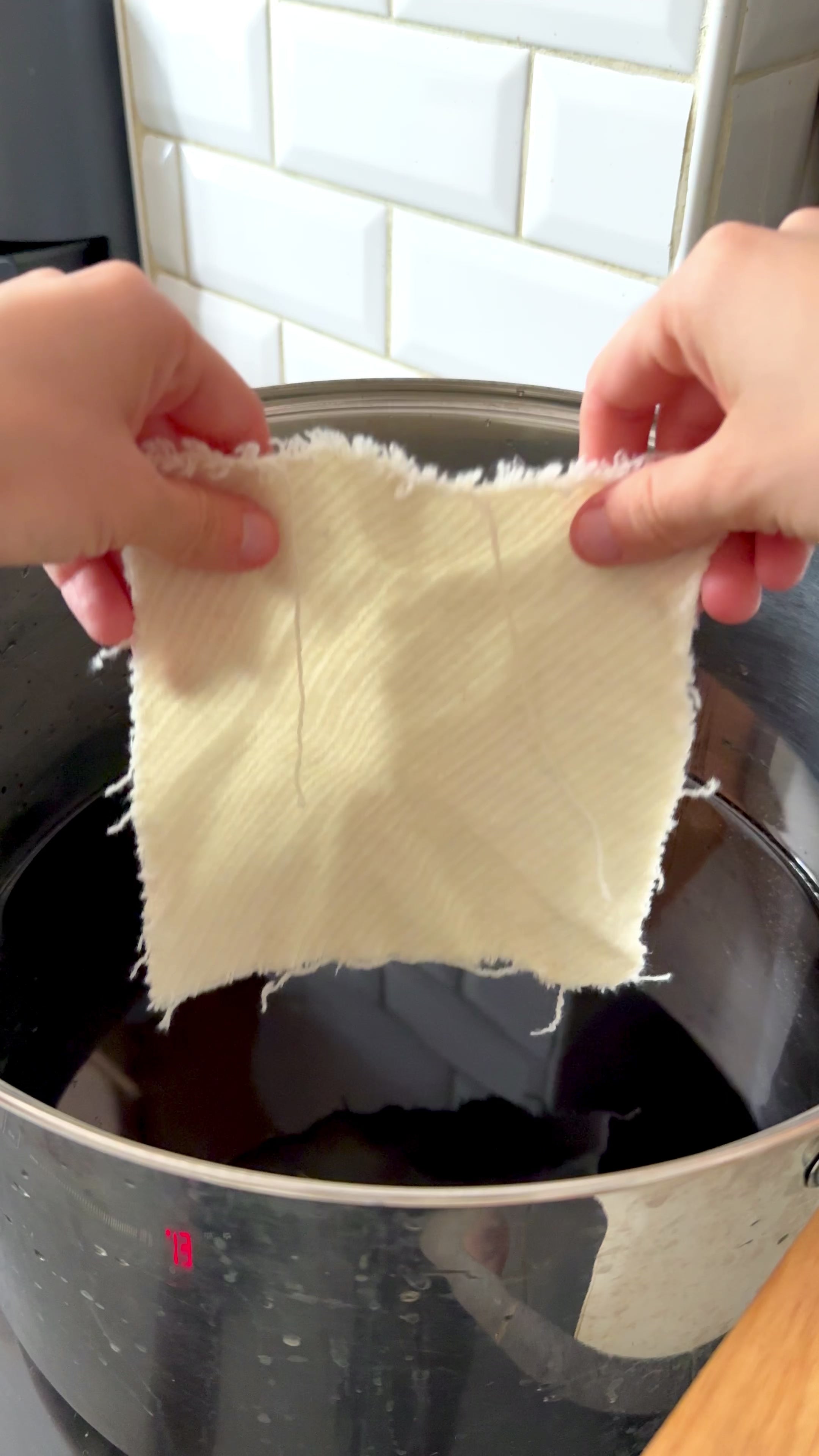 Hands-on natural dyeing process — fabric immersed in botanical dye bath — Florilegium Paris atelier